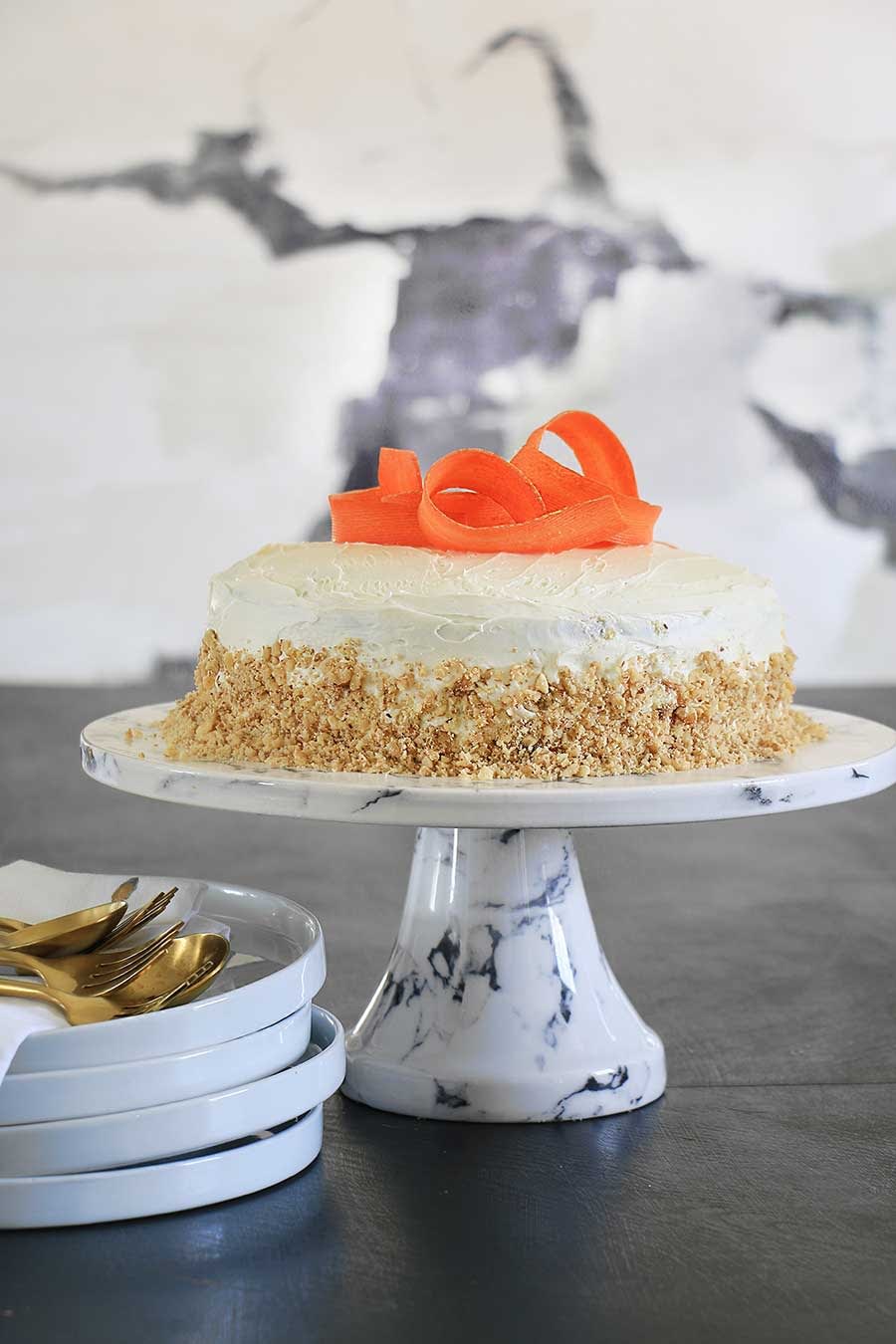 Carrot cake decorated with shaved carrots on top